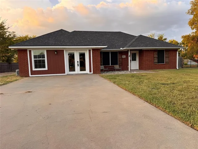 front view of a house with a yard