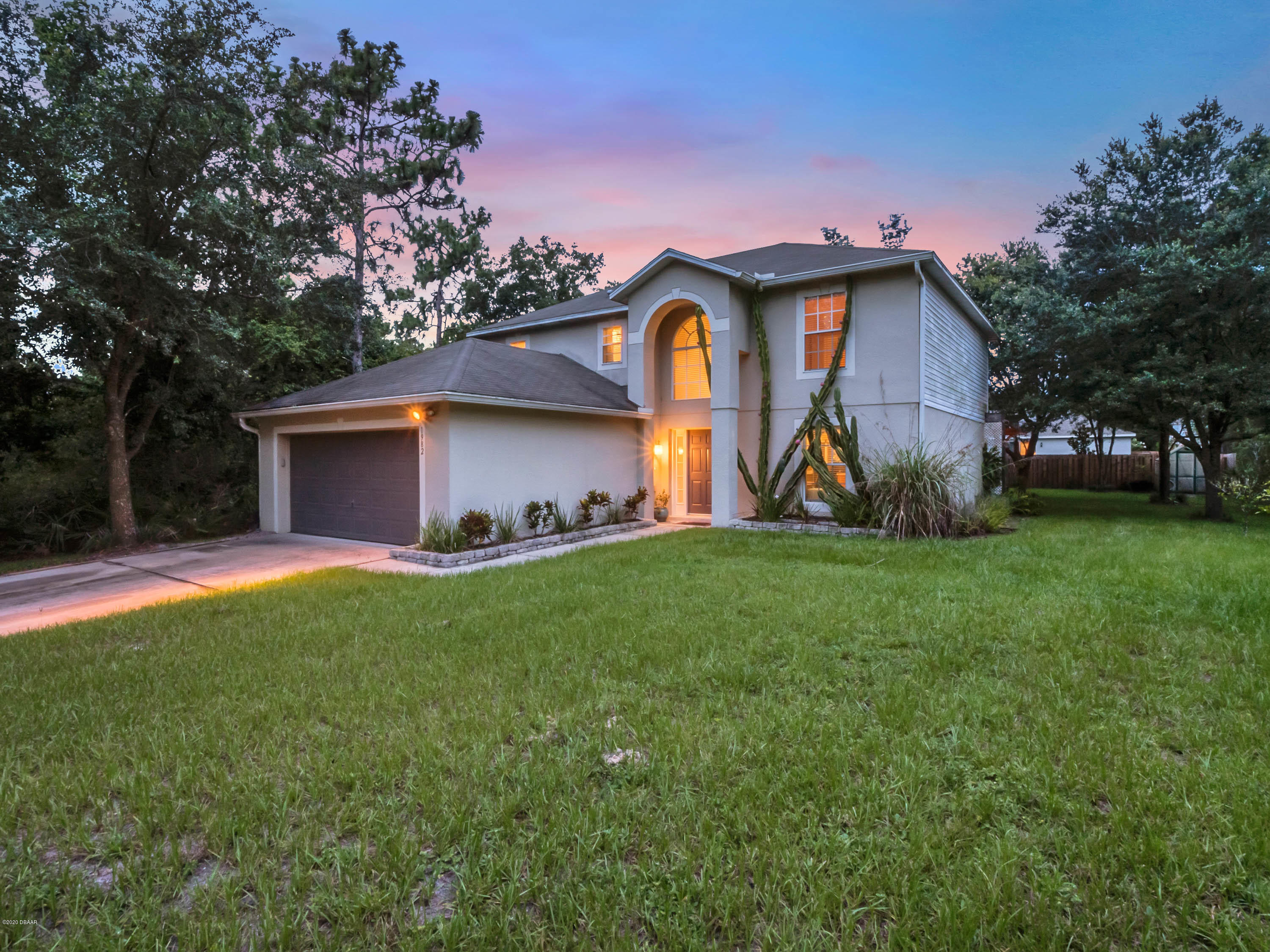 1982 7th Avenue DeLand, FL 32724 - Photo 1 of 36 a front view of house with garden