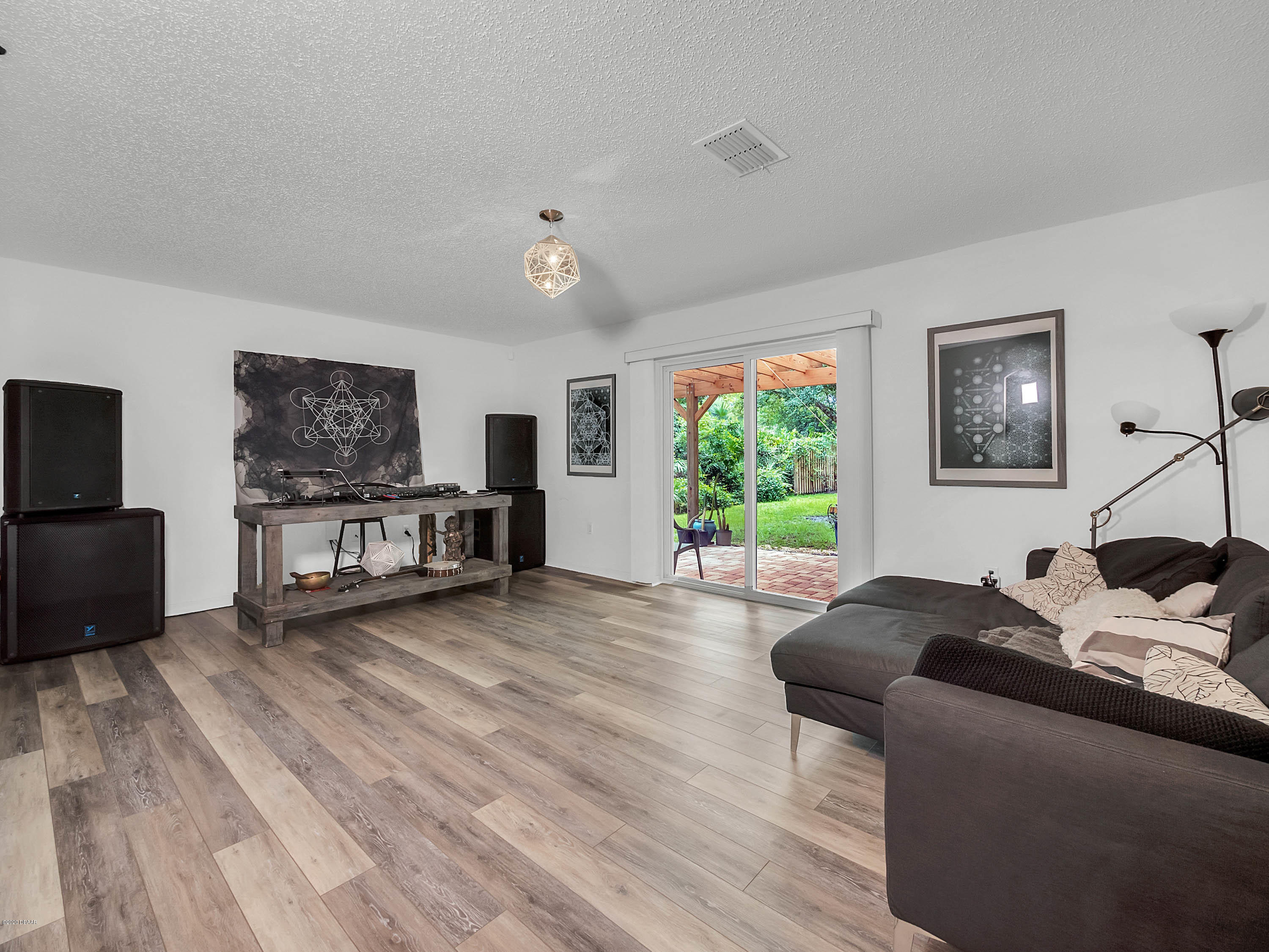 1982 7th Avenue DeLand, FL 32724 - Photo 12 of 36 a living room with furniture and a flat screen tv