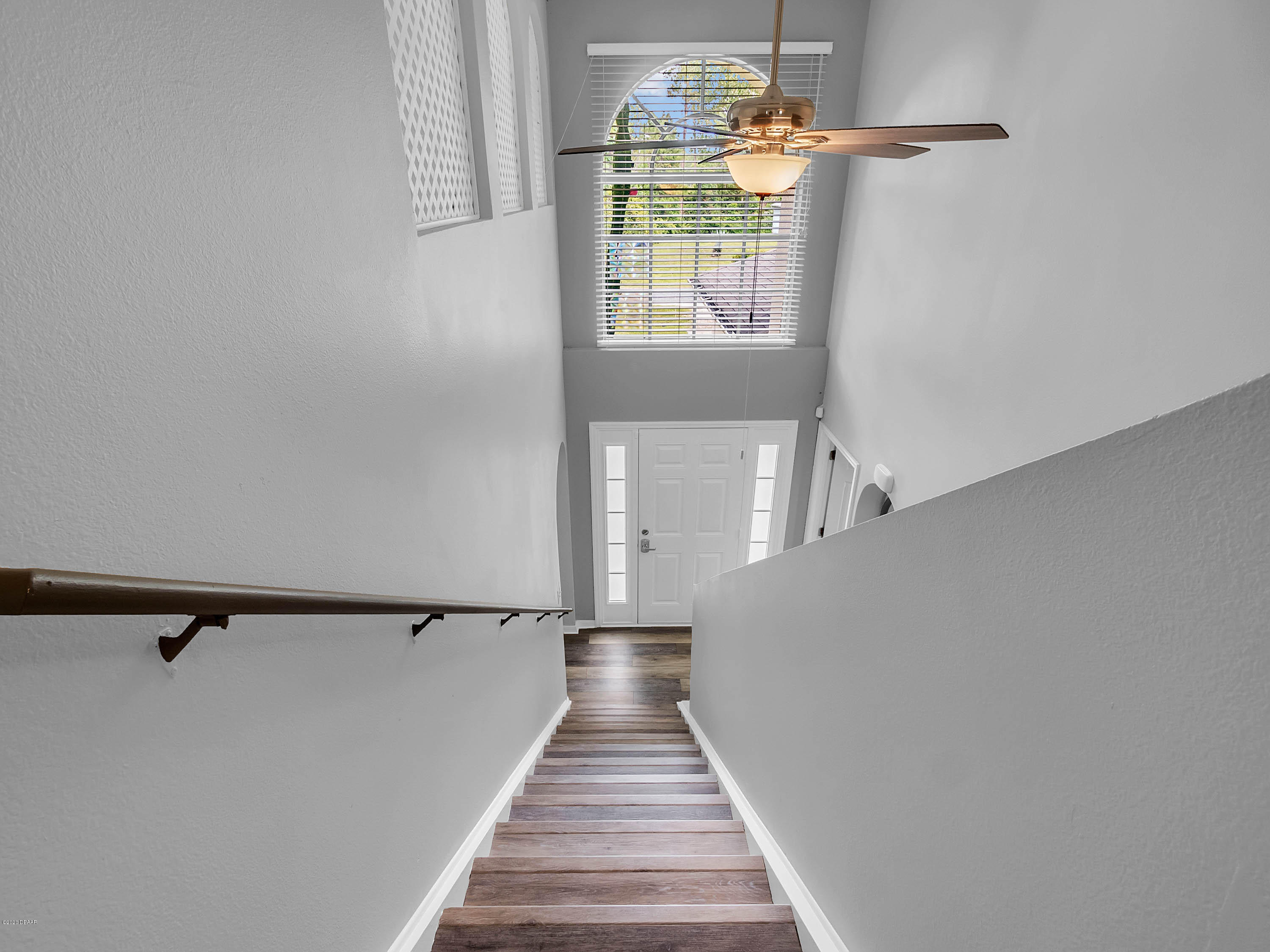1982 7th Avenue DeLand, FL 32724 - Photo 13 of 36 a view of a hallway with wooden floor and chandelier