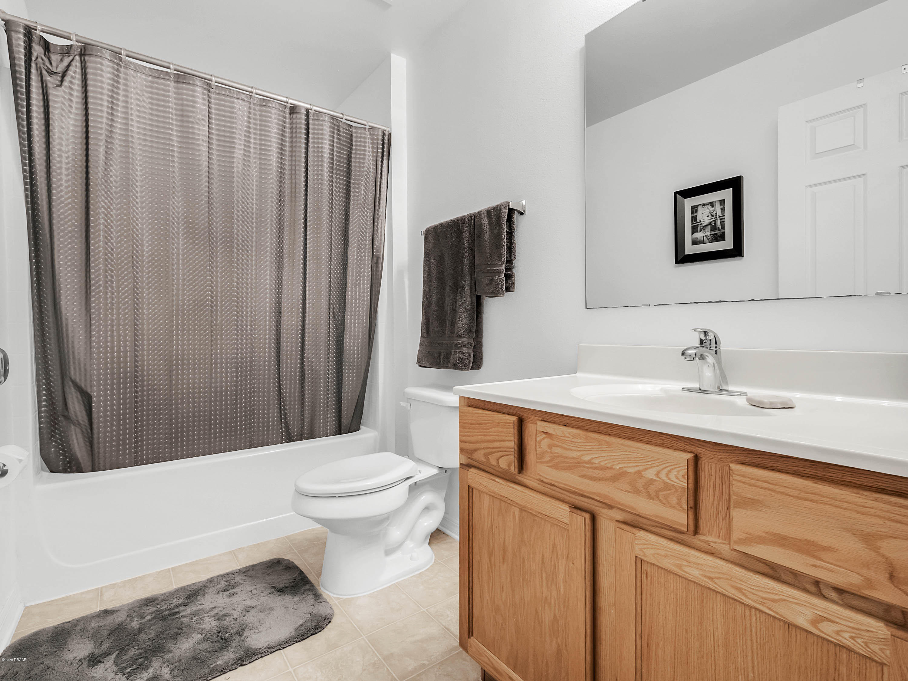 1982 7th Avenue DeLand, FL 32724 - Photo 18 of 36 a bathroom with a sink a toilet and shower