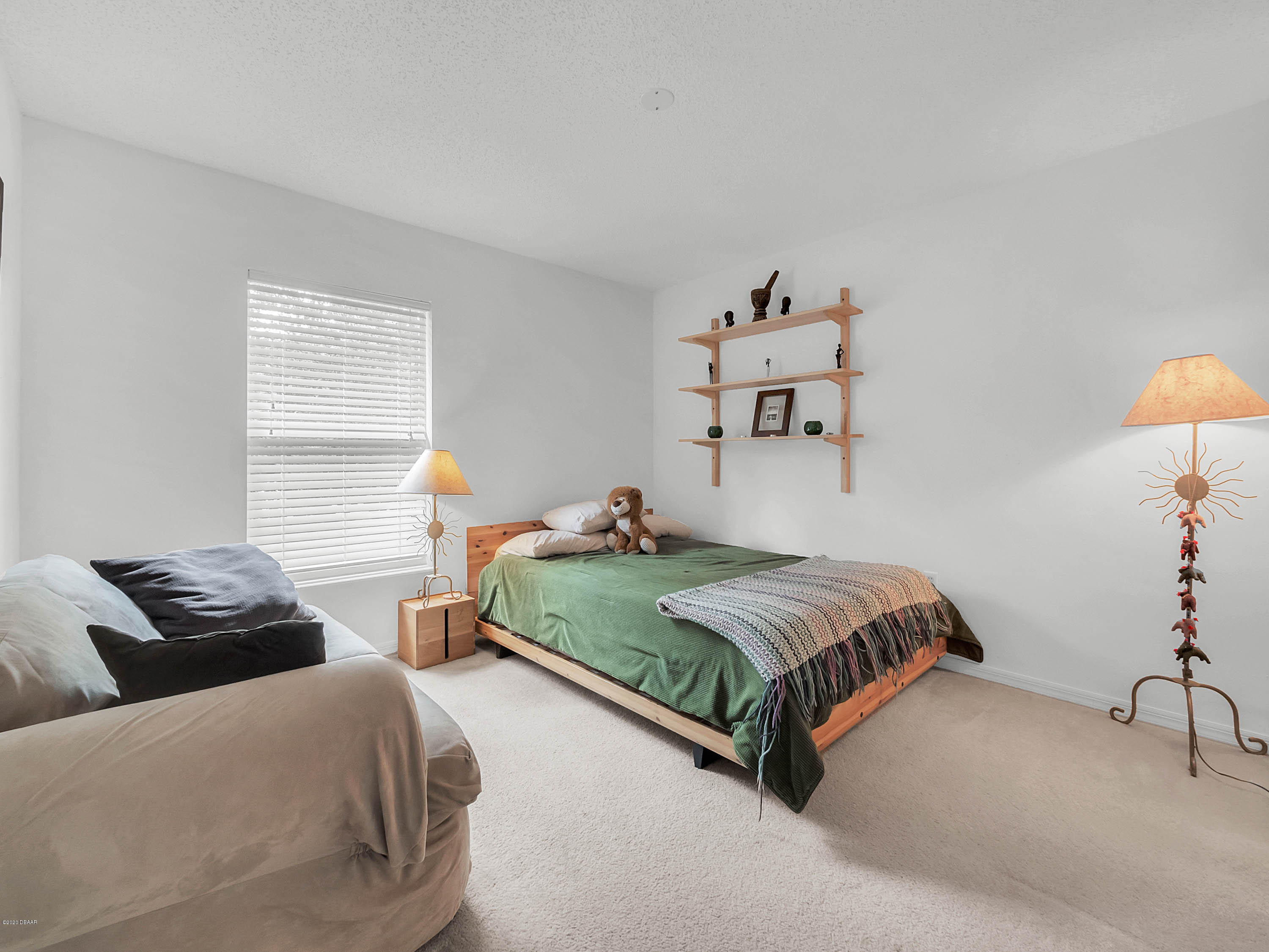 1982 7th Avenue DeLand, FL 32724 - Photo 20 of 36 a bedroom with two beds and a couch