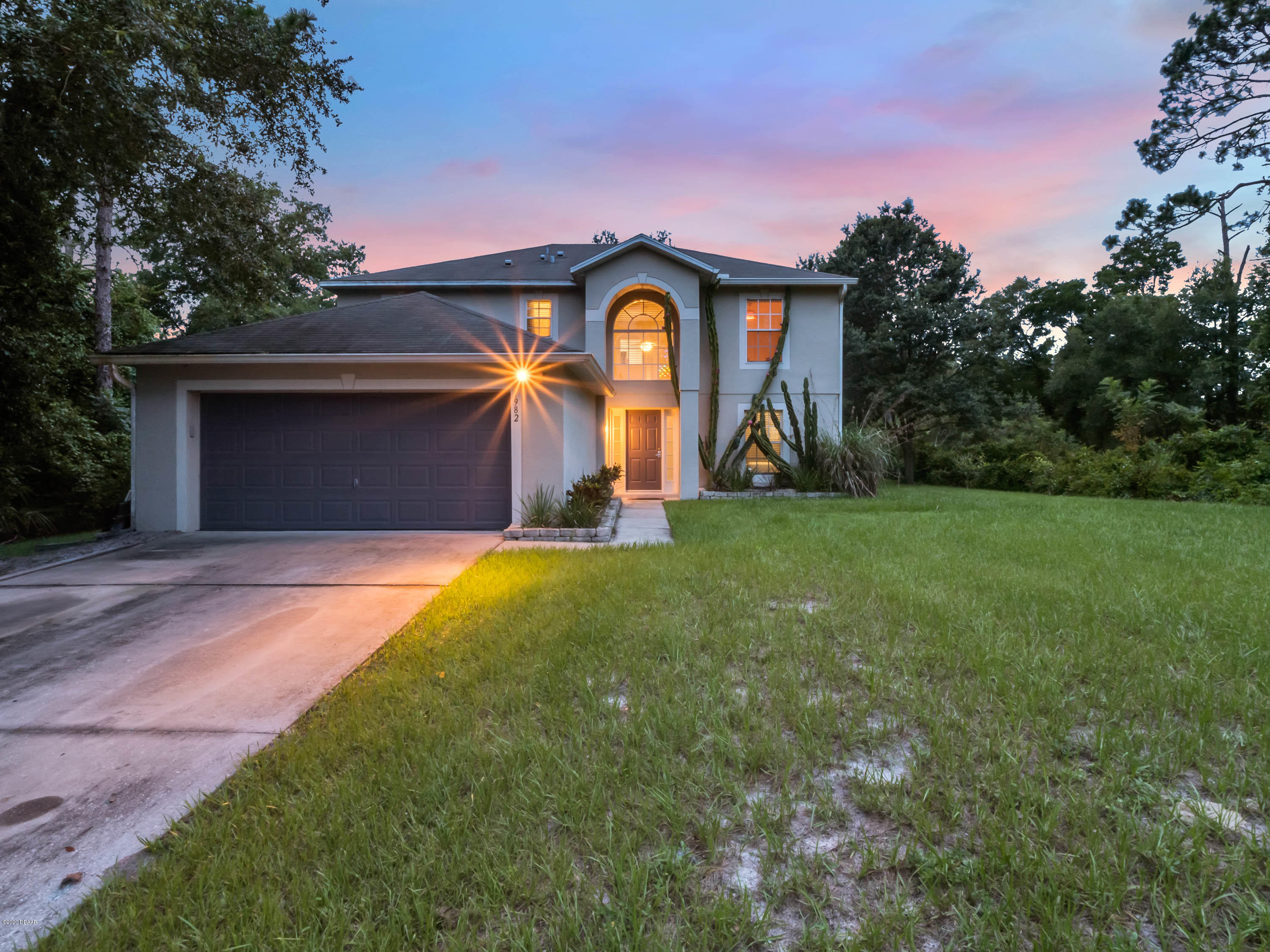 1982 7th Avenue DeLand, FL 32724 - Photo 2 of 36 a house view with a garden space