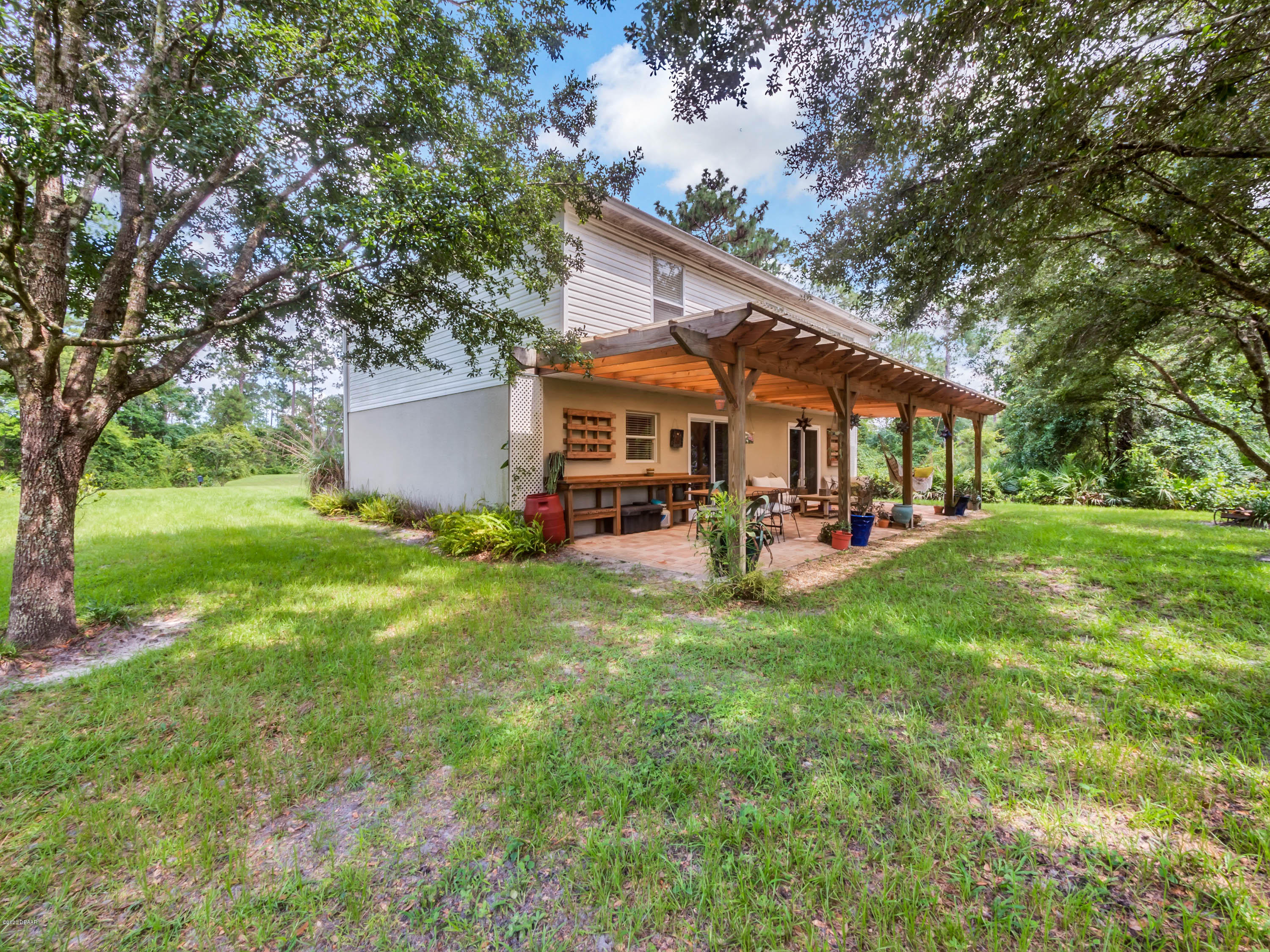 1982 7th Avenue DeLand, FL 32724 - Photo 23 of 36 a view of a house with backyard and a tree