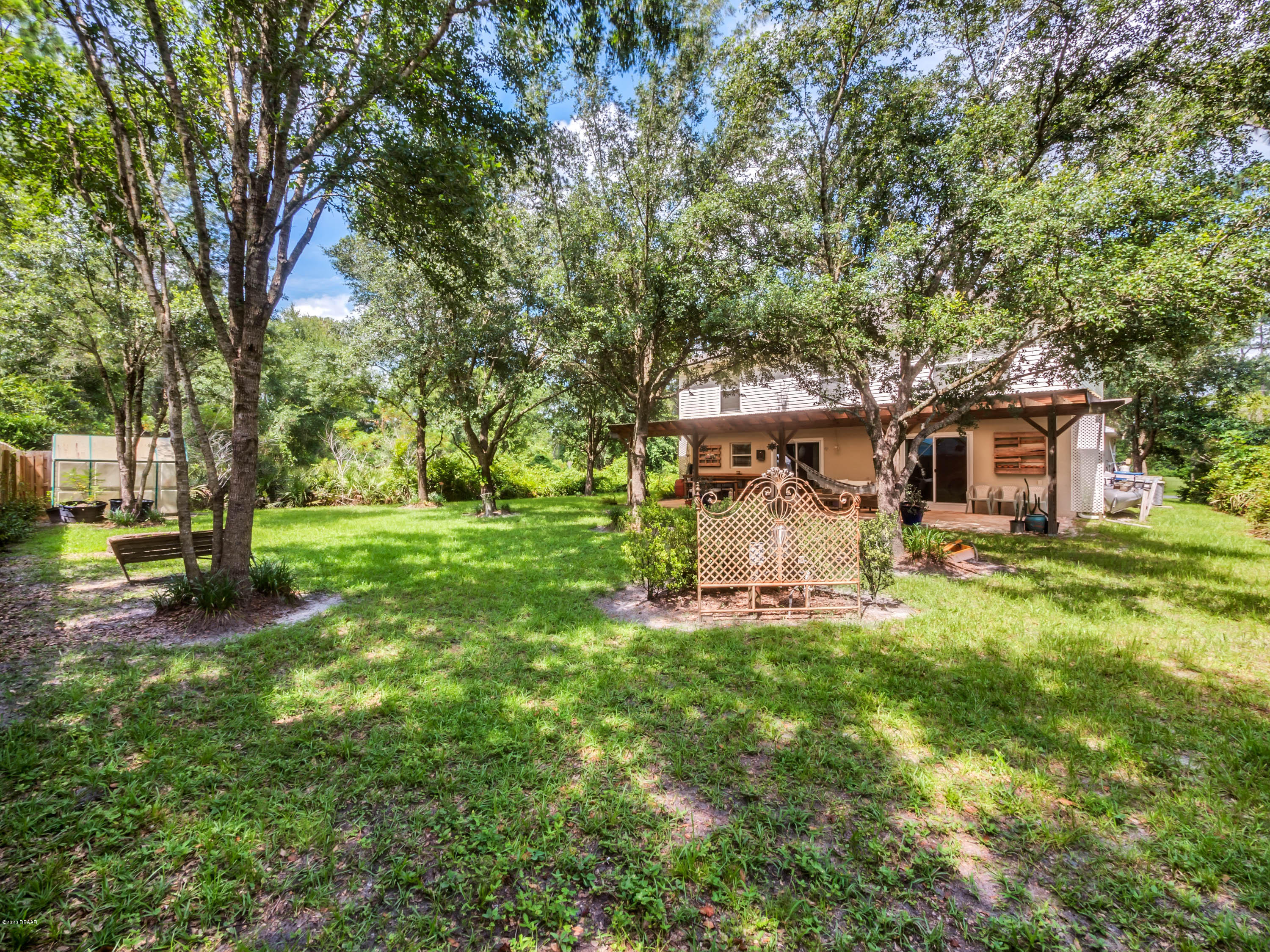 1982 7th Avenue DeLand, FL 32724 - Photo 25 of 36 a view of a house with backyard and a tree