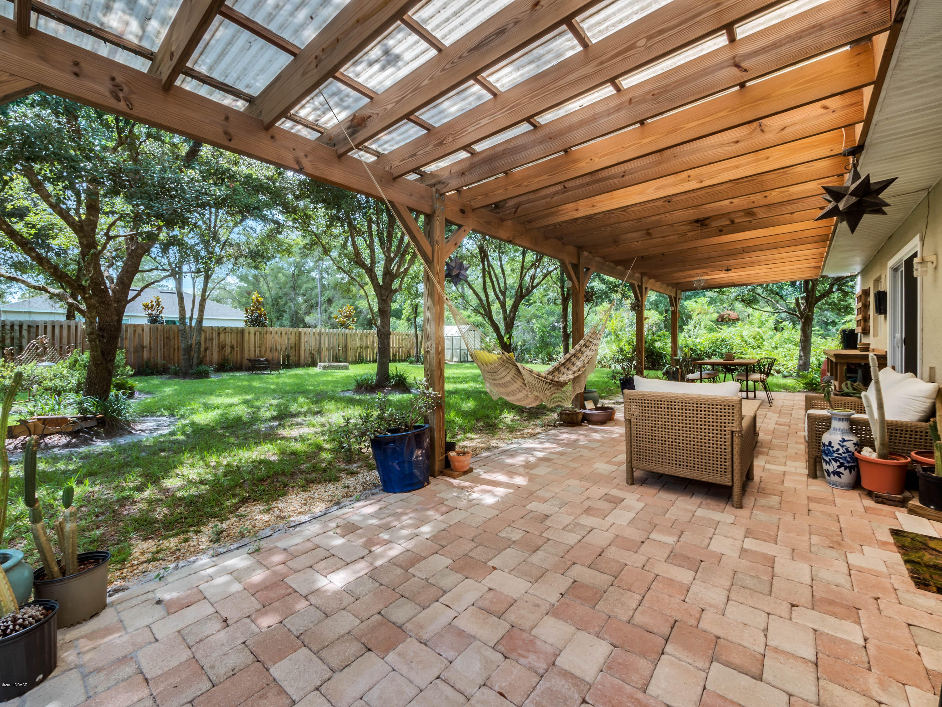 1982 7th Avenue DeLand, FL 32724 - Photo 26 of 36 a view of a patio with couches and plants