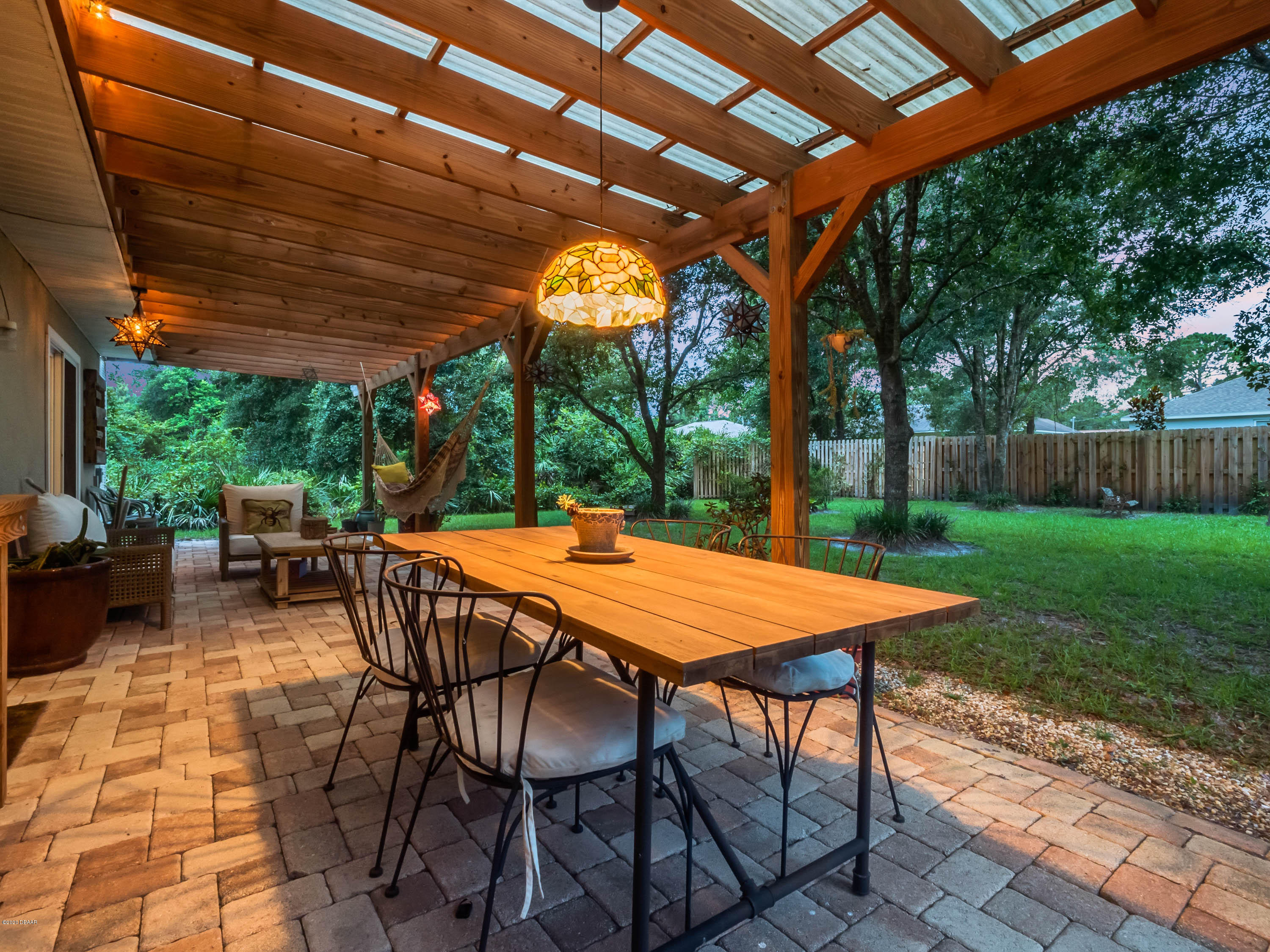 1982 7th Avenue DeLand, FL 32724 - Photo 30 of 36 a patio with a table and chairs and a barbeque