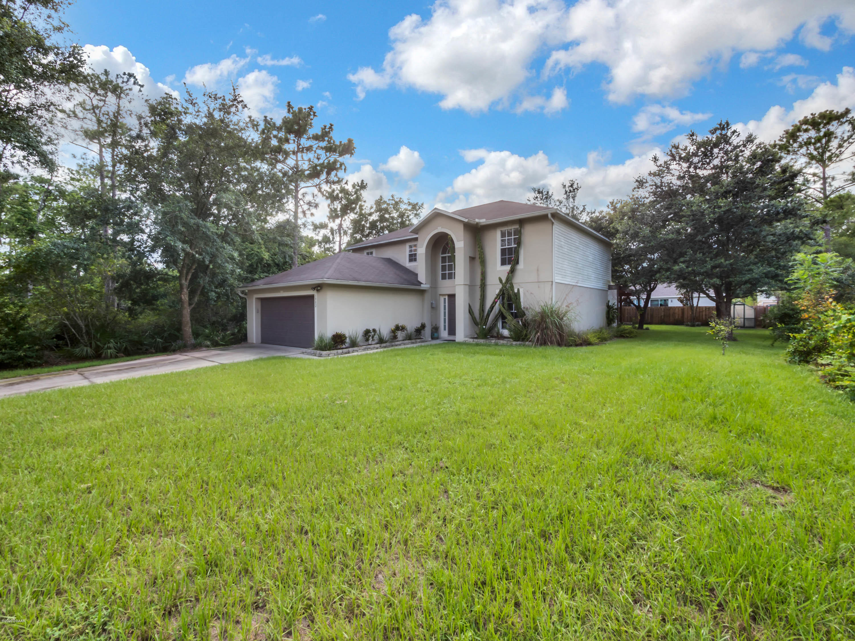 1982 7th Avenue DeLand, FL 32724 - Photo 4 of 36 a front view of a house with garden