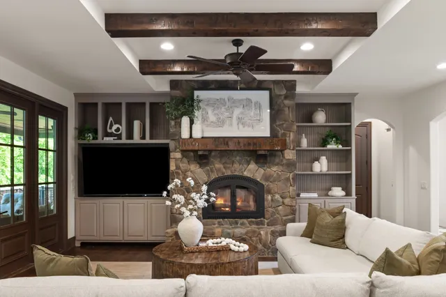 a dining room with furniture potted plants and wooden floor