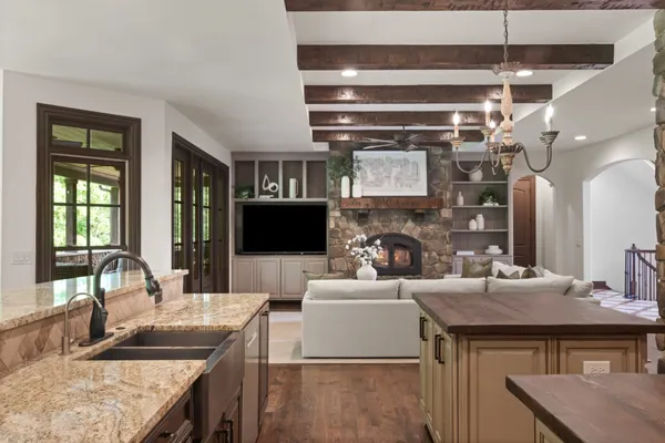 a bathroom with a double vanity sink a mirror and a bathtub