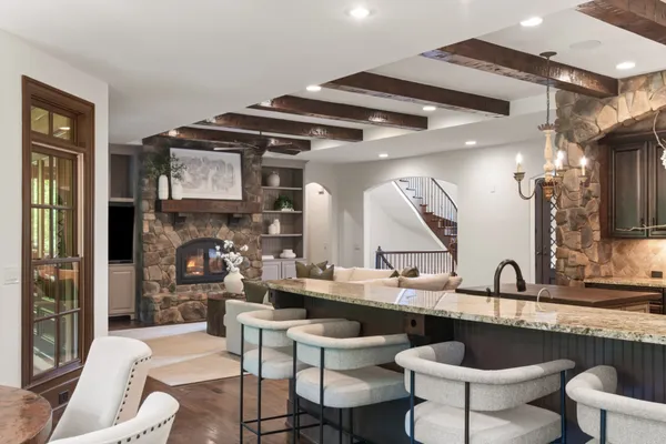 a kitchen with stainless steel appliances granite countertop a refrigerator and a sink