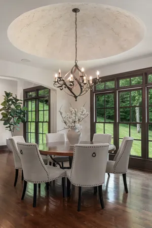 a view of an entryway with a table and chair