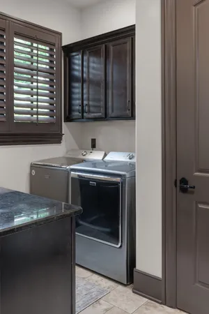 a view of a kitchen with a sink and a window