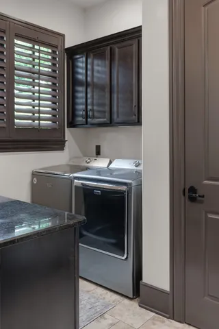 a view of a kitchen with a sink and a window