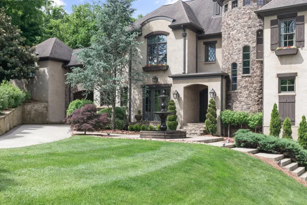 a front view of a house with garden