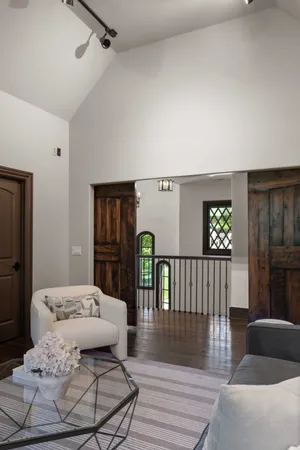 a aerial view of a house with a yard porch and sitting area