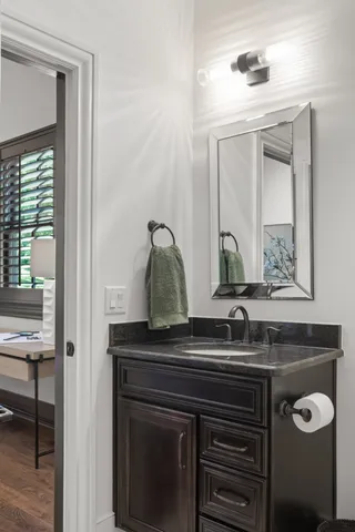 an aerial view of green landscape with trees houses and mountain view