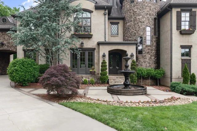 a front view of a house with garden