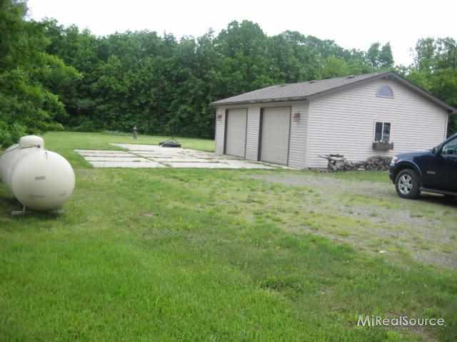 1705 Stoddard Road Columbus, MI 48063 - Photo 8 of 26 220, heat & insulalted & 20 cement pads for extra parking, insulated door & service doors