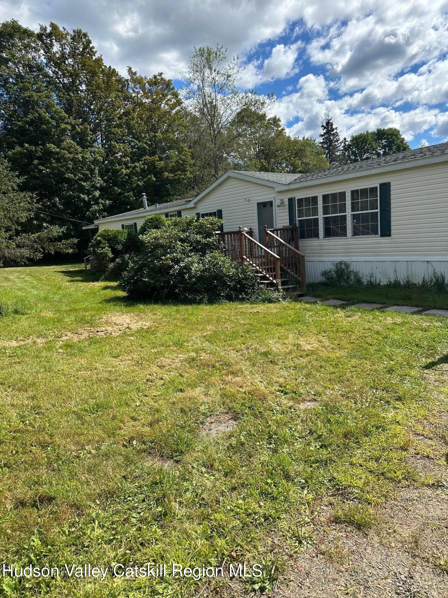 3285 Middlebrook Hill Road Jefferson, NY 12093 - Photo 12 of 16 a view of a house with a yard