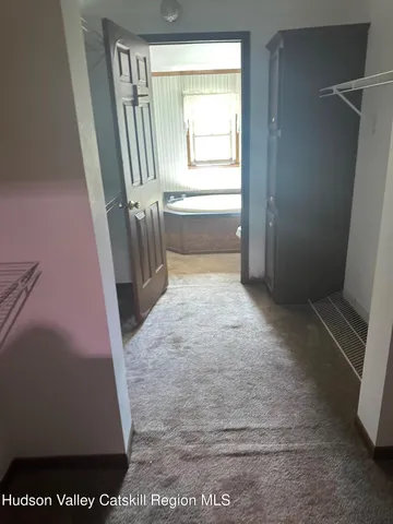 a room with furniture and a large window