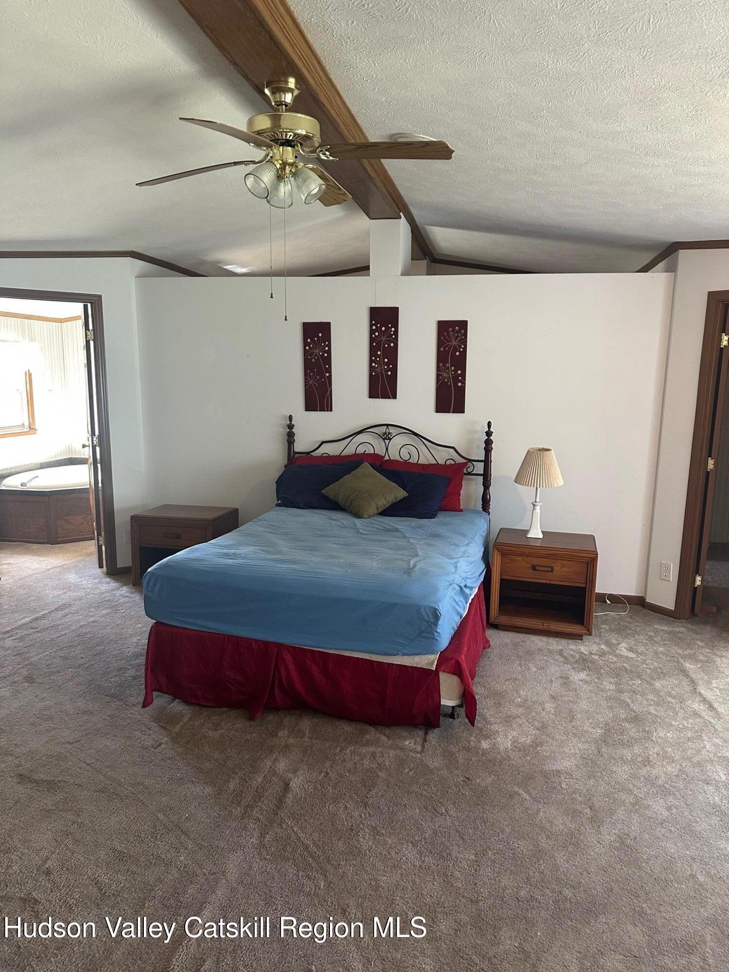 3285 Middlebrook Hill Road Jefferson, NY 12093 - Photo 16 of 16 a bedroom with a bed and a window