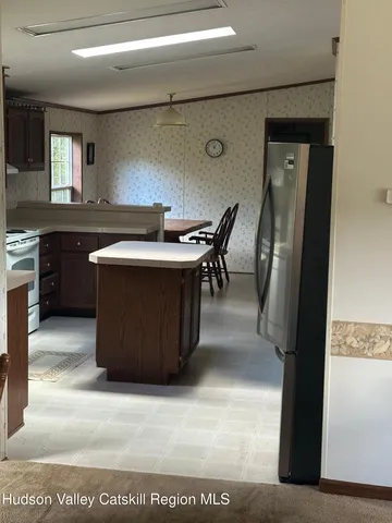 a view living room with granite countertop furniture and a kitchen view