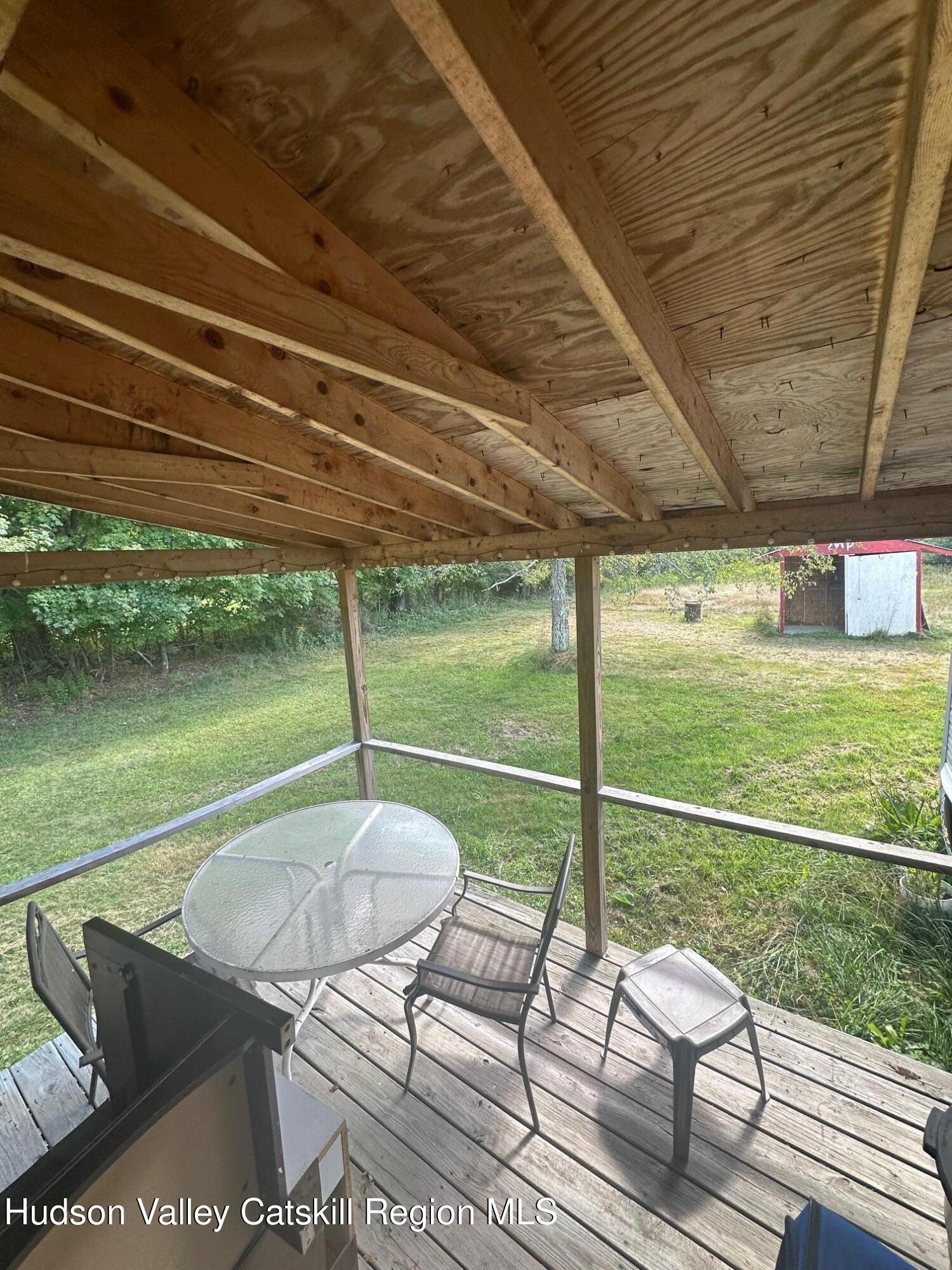 3285 Middlebrook Hill Road Jefferson, NY 12093 - Photo 8 of 16 a view of a chairs and table in the balcony