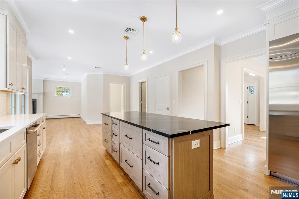 62 Colony Avenue Park Ridge, NJ 07656 - Photo 14 of 50 a spacious bathroom with a granite countertop sink a large mirror and a shower