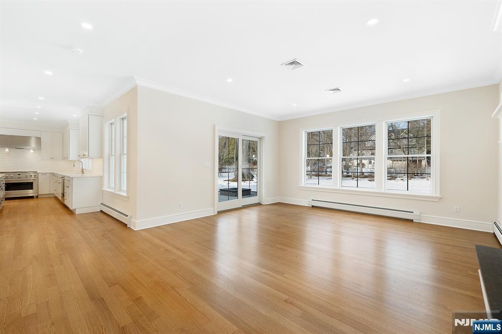 62 Colony Avenue Park Ridge, NJ 07656 - Photo 19 of 50 a view of an empty room with wooden floor and a window