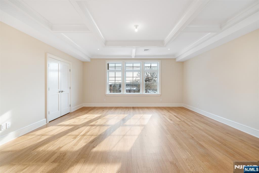 62 Colony Avenue Park Ridge, NJ 07656 - Photo 28 of 50 an empty room with wooden floor and windows
