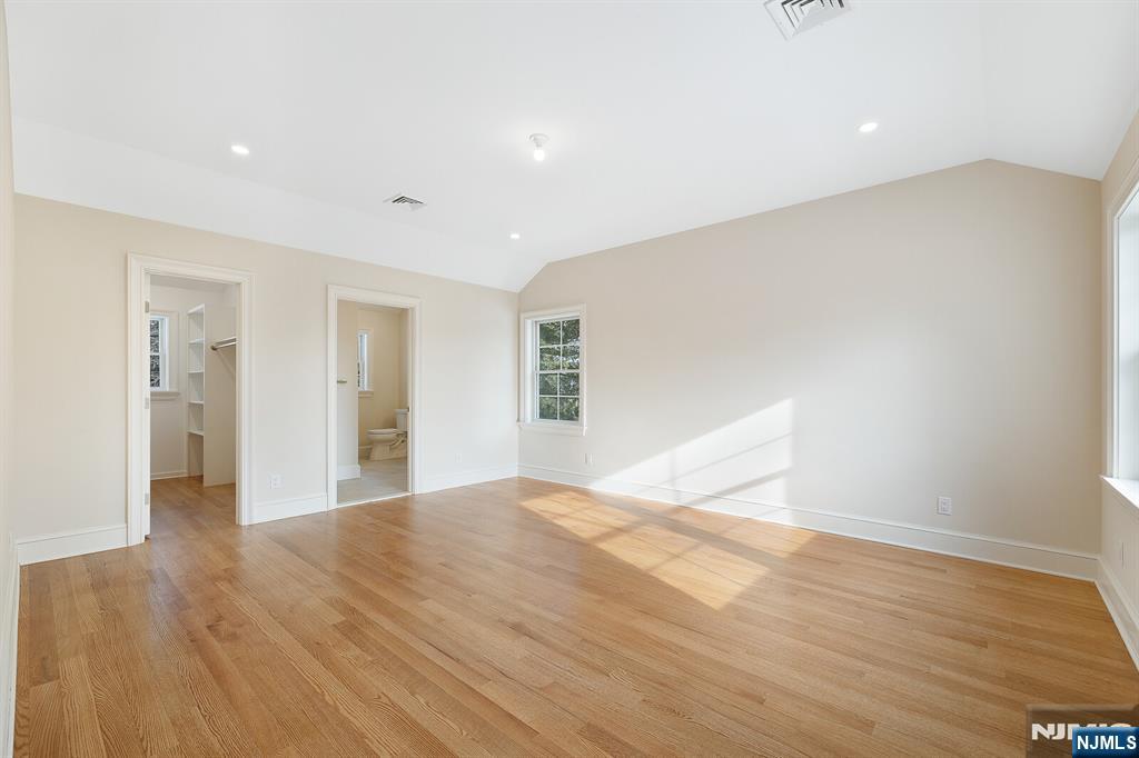 62 Colony Avenue Park Ridge, NJ 07656 - Photo 34 of 50 a view of an empty room with wooden floor and a window