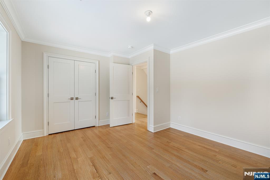 62 Colony Avenue Park Ridge, NJ 07656 - Photo 39 of 50 a view of an empty room and wooden floor