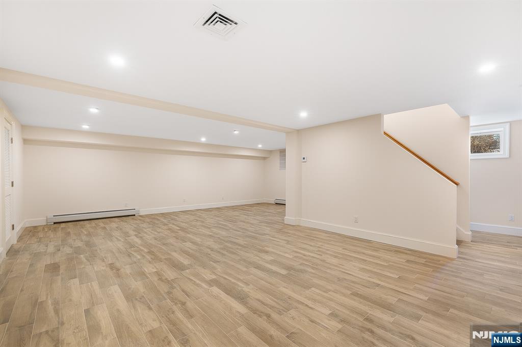 62 Colony Avenue Park Ridge, NJ 07656 - Photo 42 of 50 a view of an empty room with wooden floor