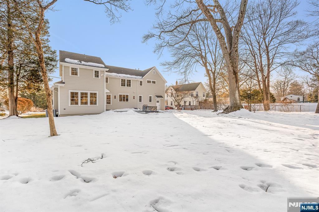 62 Colony Avenue Park Ridge, NJ 07656 - Photo 48 of 50 a view of white house with a snow in the yard