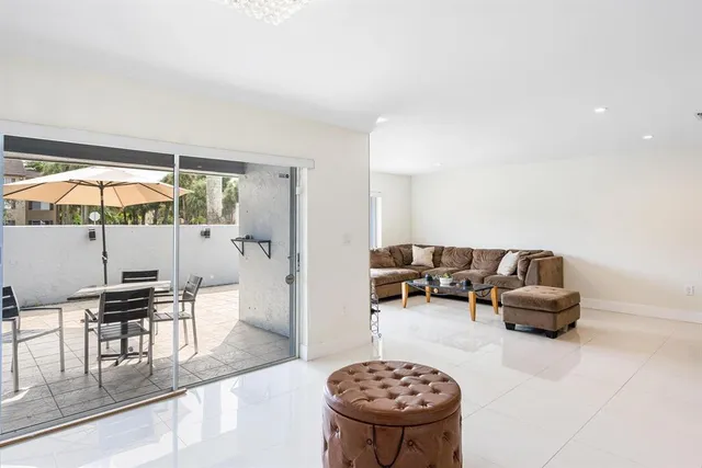 a living room with furniture and a chair