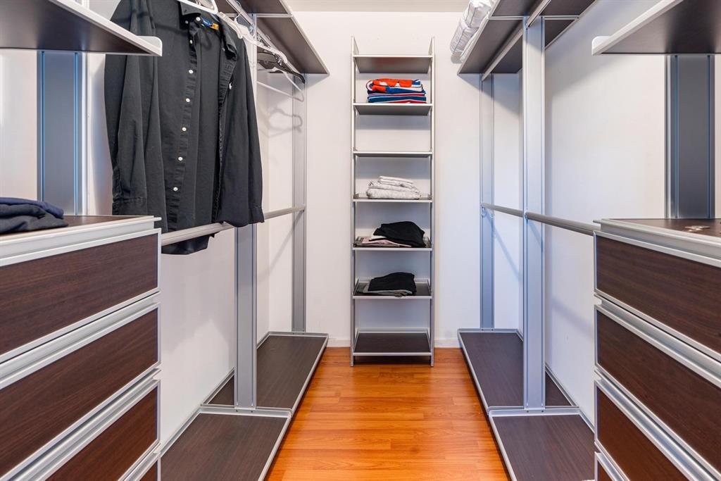 9703 Southwest 142nd Court Miami, FL 33186 - Photo 21 of 36 a view of walk in closet with clothes and shoes