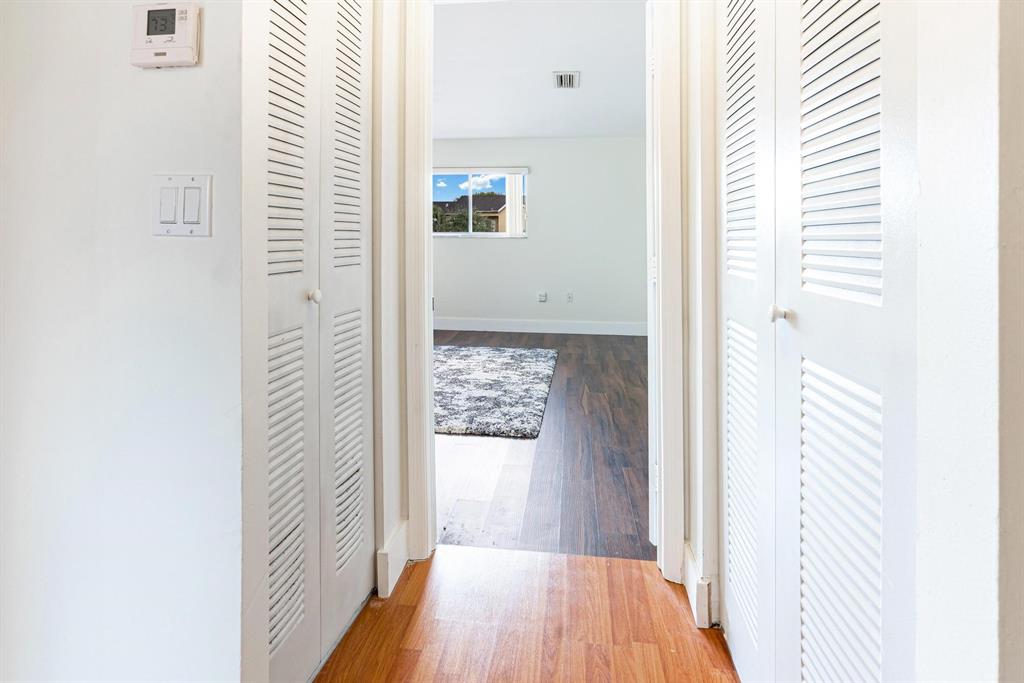9703 Southwest 142nd Court Miami, FL 33186 - Photo 27 of 36 a view of a hallway with wooden floor