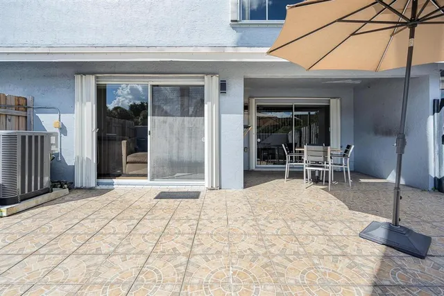 a backyard of a house with yard and seating space