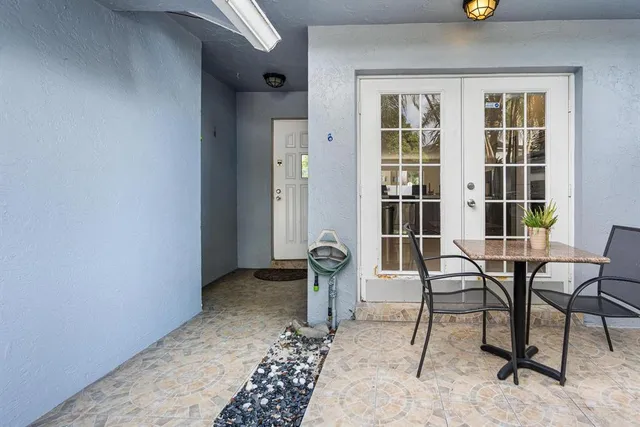a view of a livingroom with furniture and front door