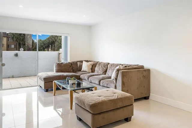 a living room with a couch and a large window