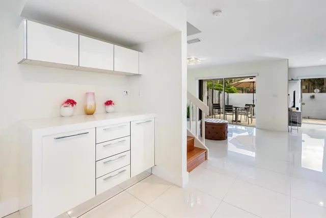 a kitchen with cabinets and window