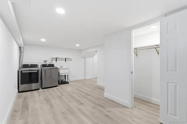 a view of a kitchen with a sink and a stove top oven
