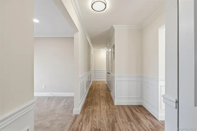 a view of a room with wooden floor and staircase