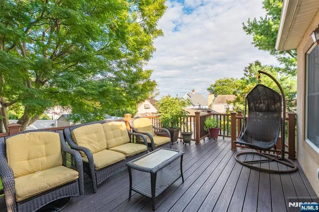 a patio with patio a couch and wooden floor