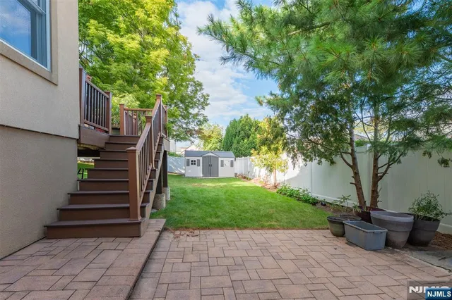 a view of a house with backyard