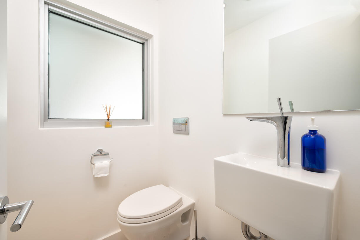 30680 Winifred Street Big Pine Key, FL 33043 - Photo 23 of 73 a bathroom with a toilet sink and mirror