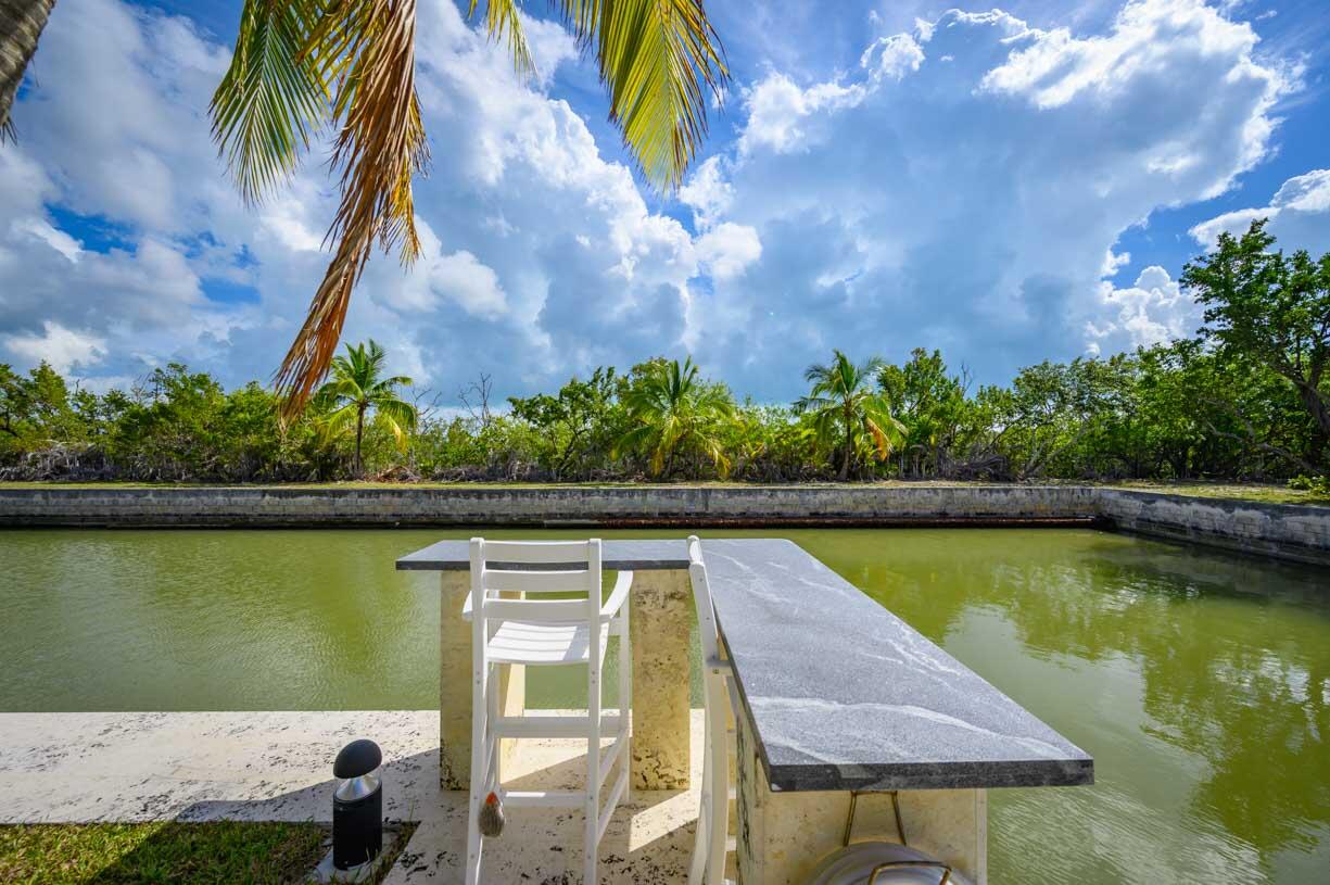 30680 Winifred Street Big Pine Key, FL 33043 - Photo 50 of 73 a view of swimming pool with outdoor seating and lake