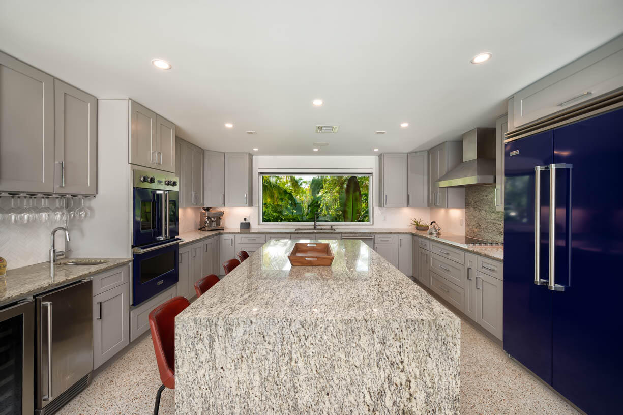 30680 Winifred Street Big Pine Key, FL 33043 - Photo 10 of 73 a large kitchen with stainless steel appliances kitchen island granite countertop a refrigerator and a sink