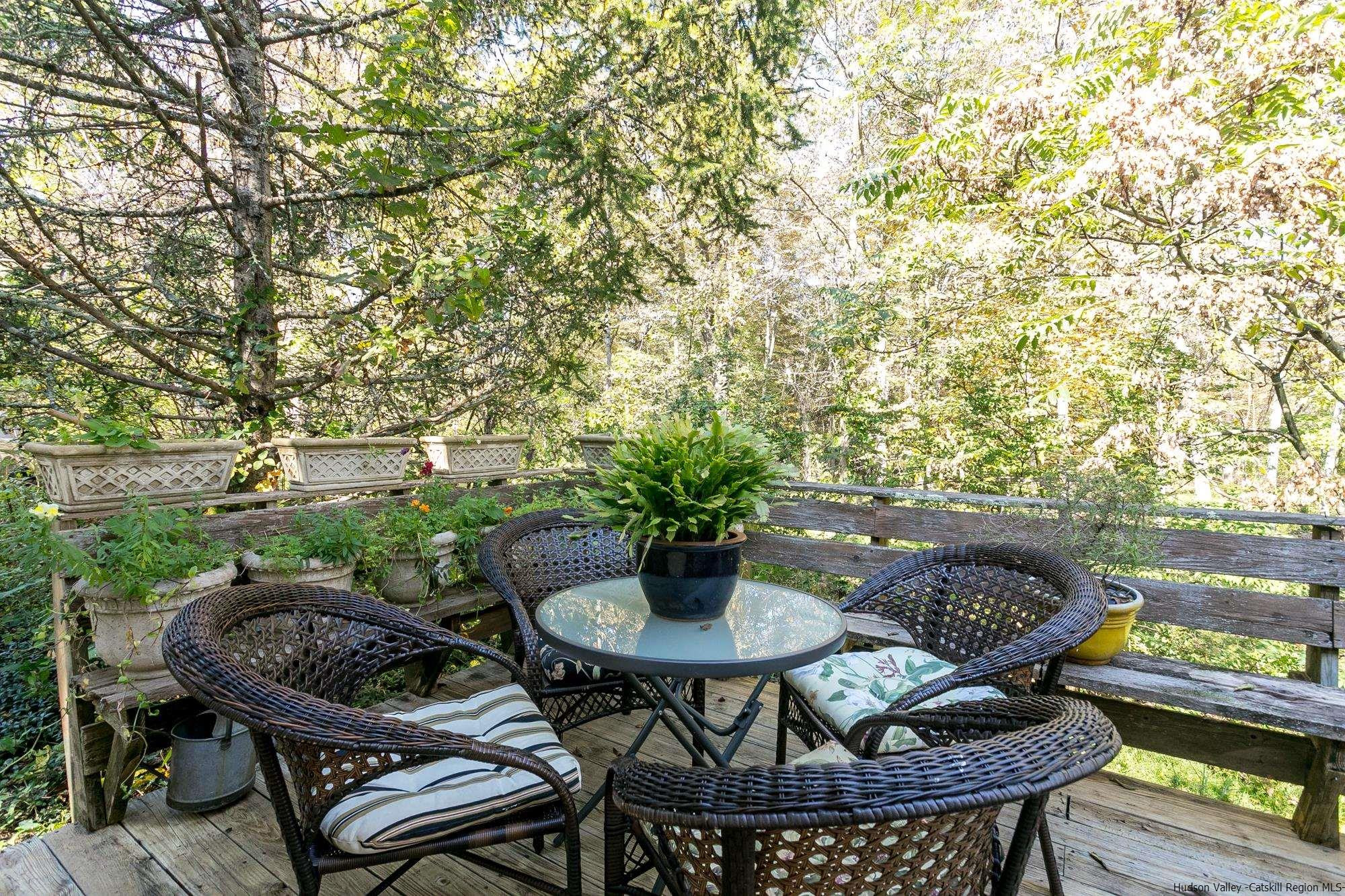 169 Marcott Road Kingston, NY 12401 - Photo 22 of 32 a backyard of a house with table and chairs